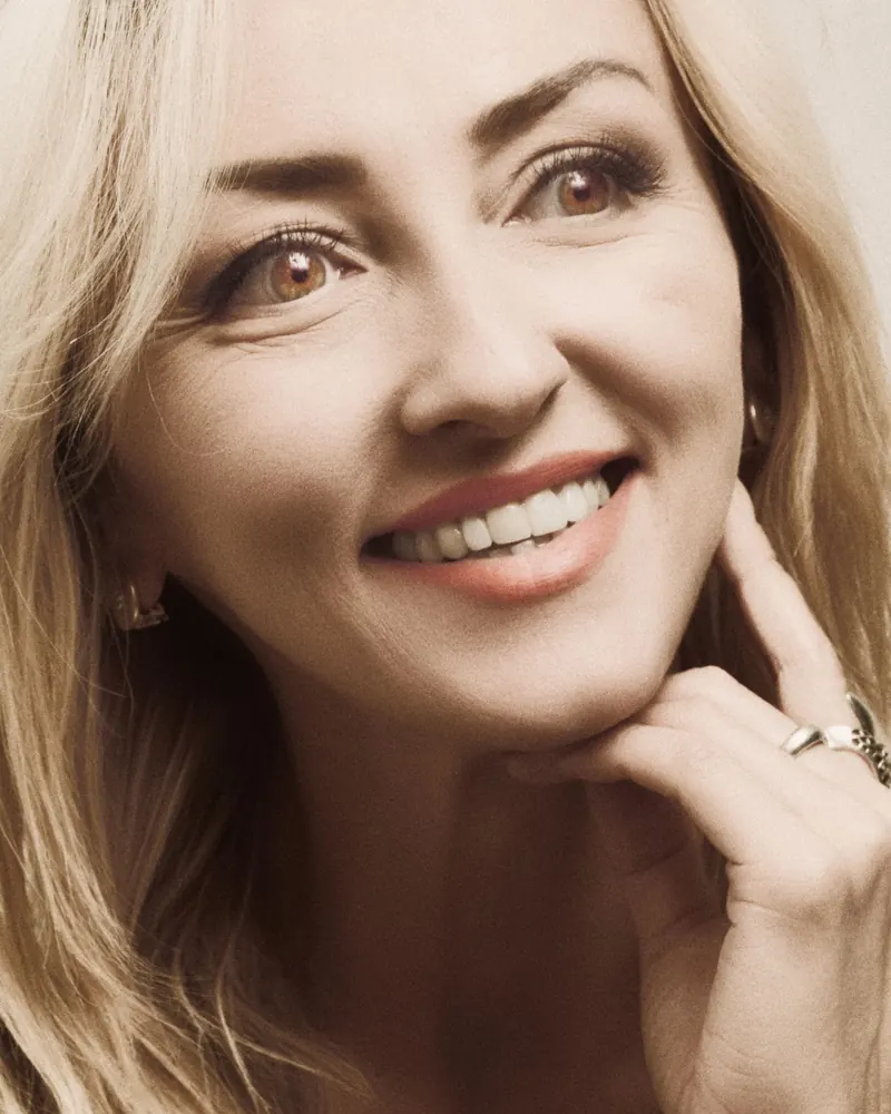 Radiant mature woman with smooth, firm skin, laughing